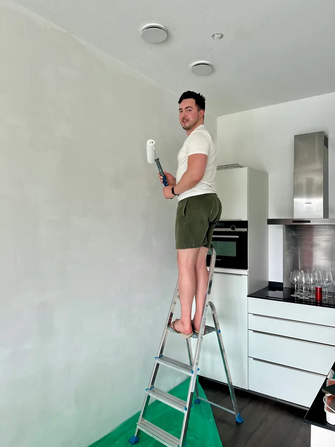 Klaudio painting their home