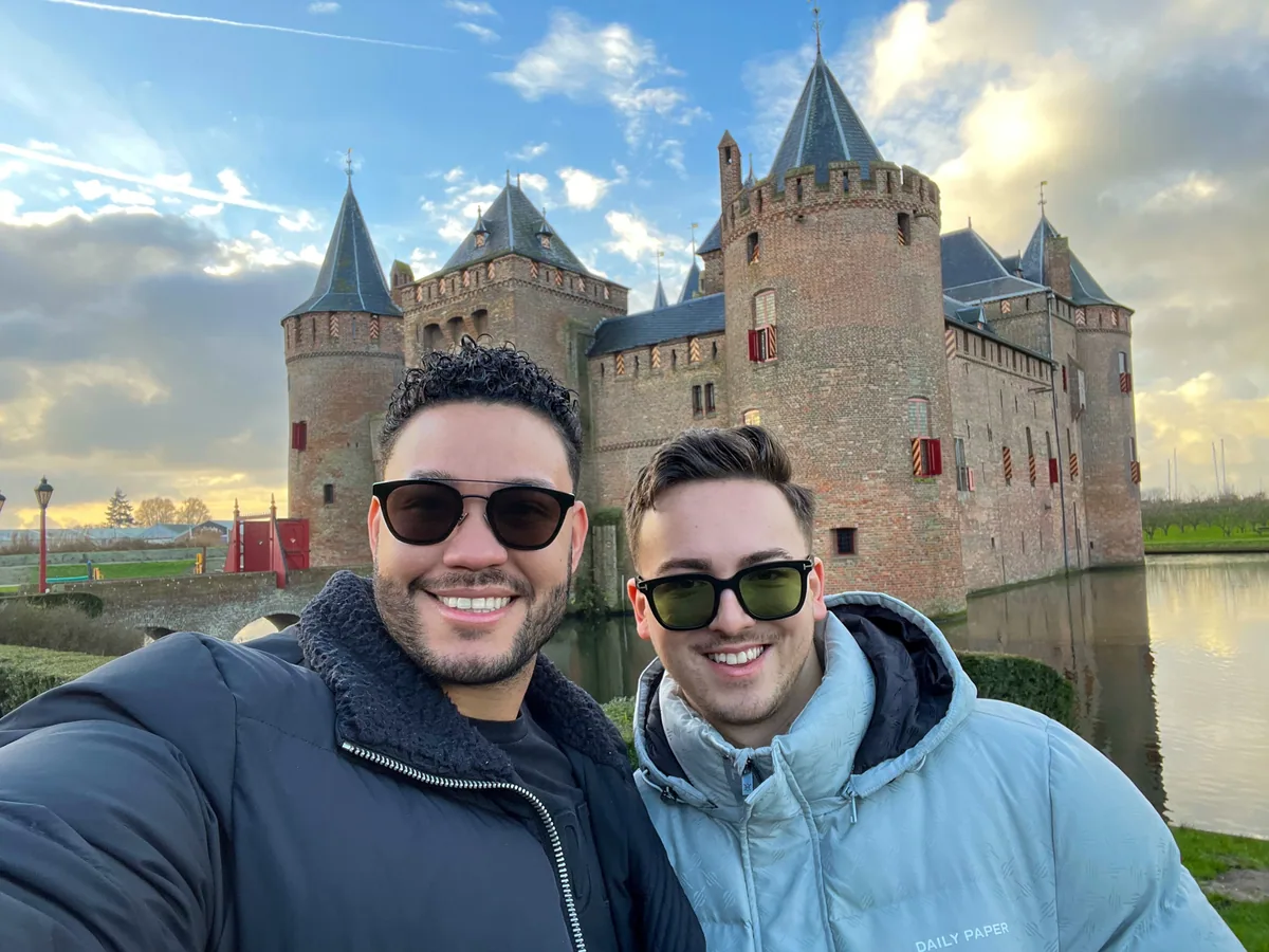 Klaudio and Derick together in front of a castle