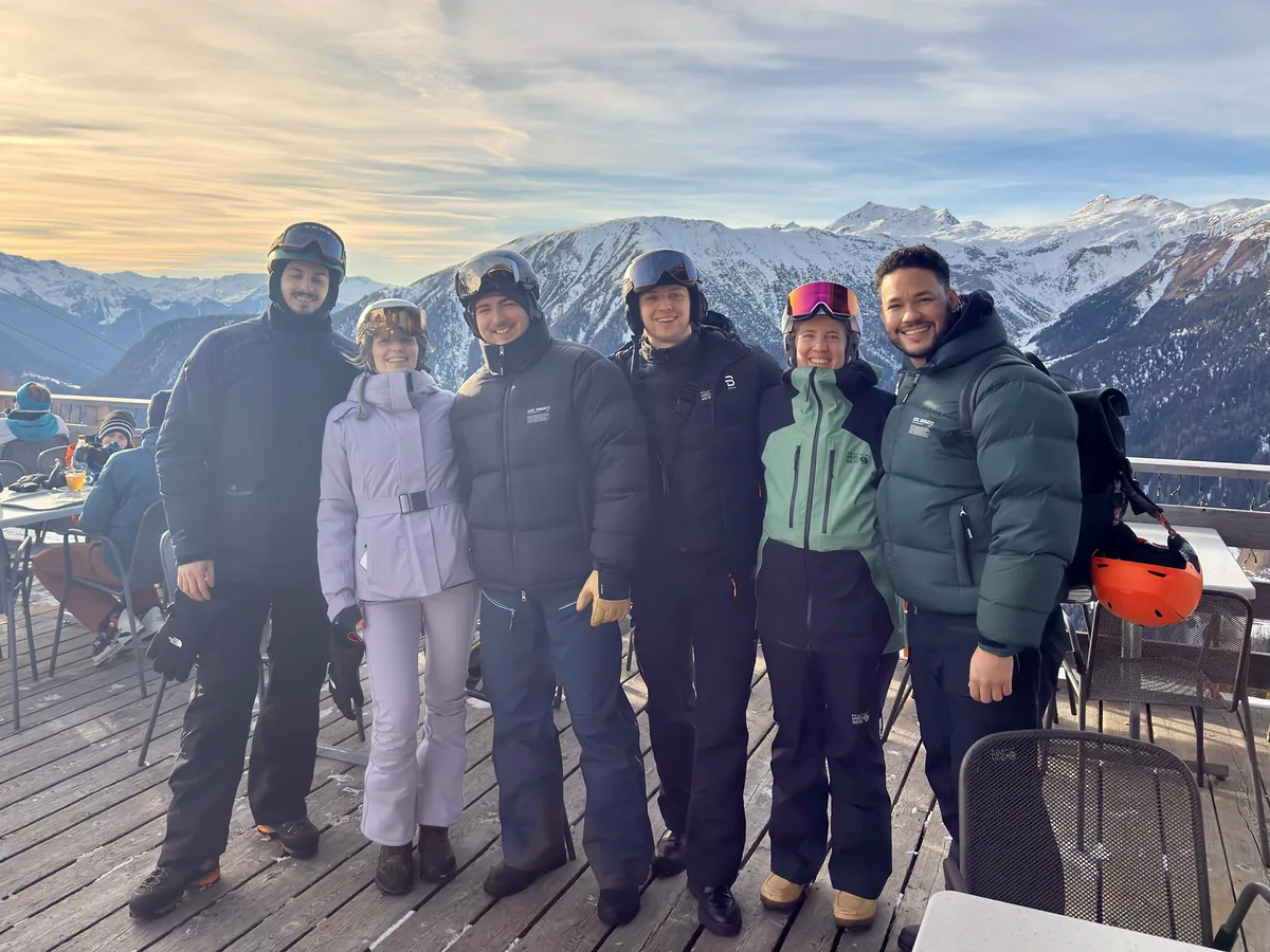 Klaudio, Derick, and friends together in the mountains on a ski trip